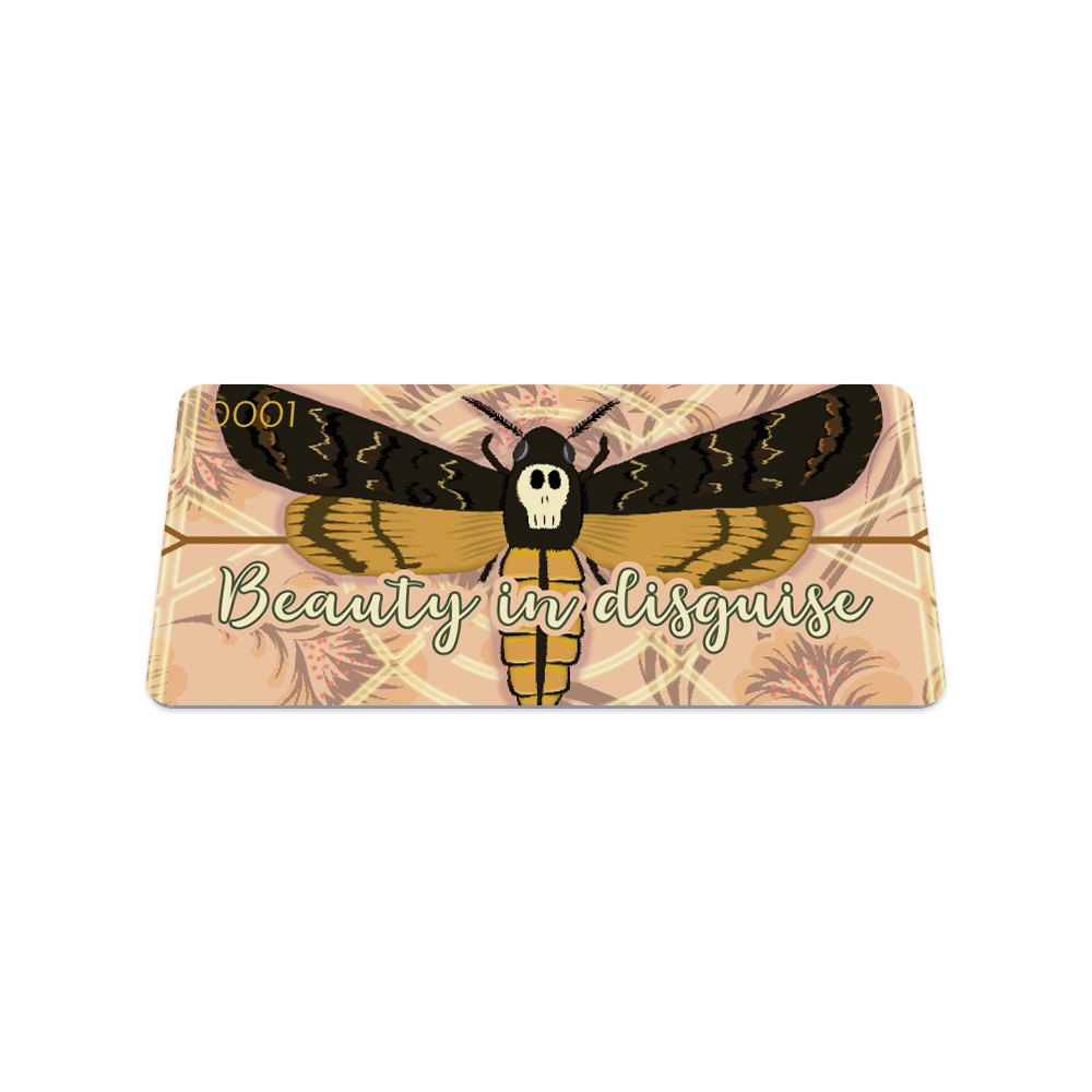Front collector's card image of Beauty in Disguise, a tan design with cream and brown geometric details with a moth in the center