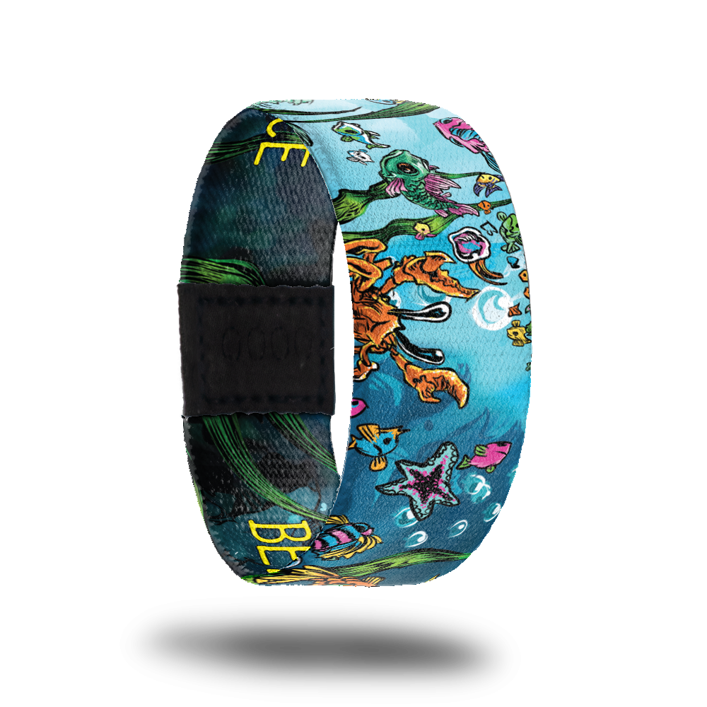 Brightly colored water scene of aquatic life like crabs, fish, starfish, seaweed, etc. Inside is the dark ocean with no creatures and reads Beneath the Surface.  Comes with a matching pink octopus puzzle. 