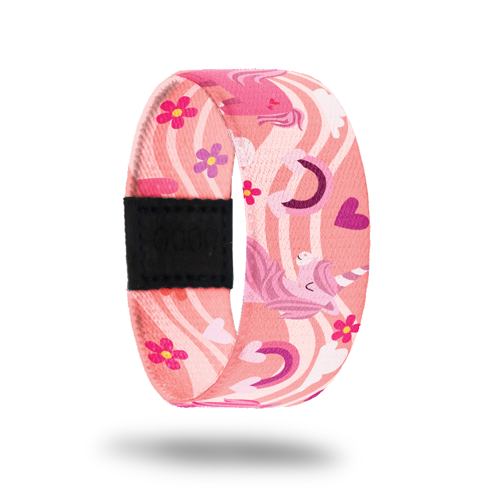 Outside design for Bestie. A pink background with a lighter pink wave that goes across the design. Rainbows and hearts in shades of pink and Unicorns in shades of pink and purple