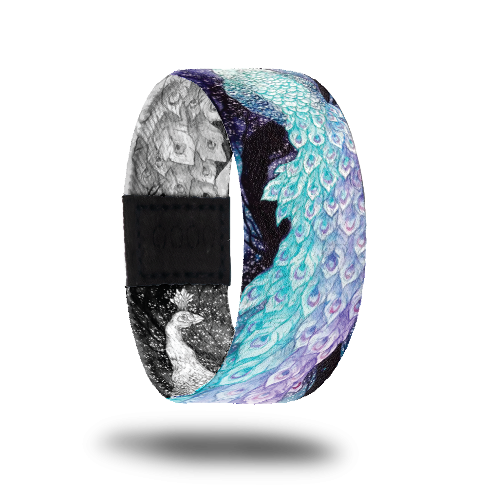 Outside design of BeYOUtiful is of a color illustrated peacock with light blue and light purple feathers with a dark background
