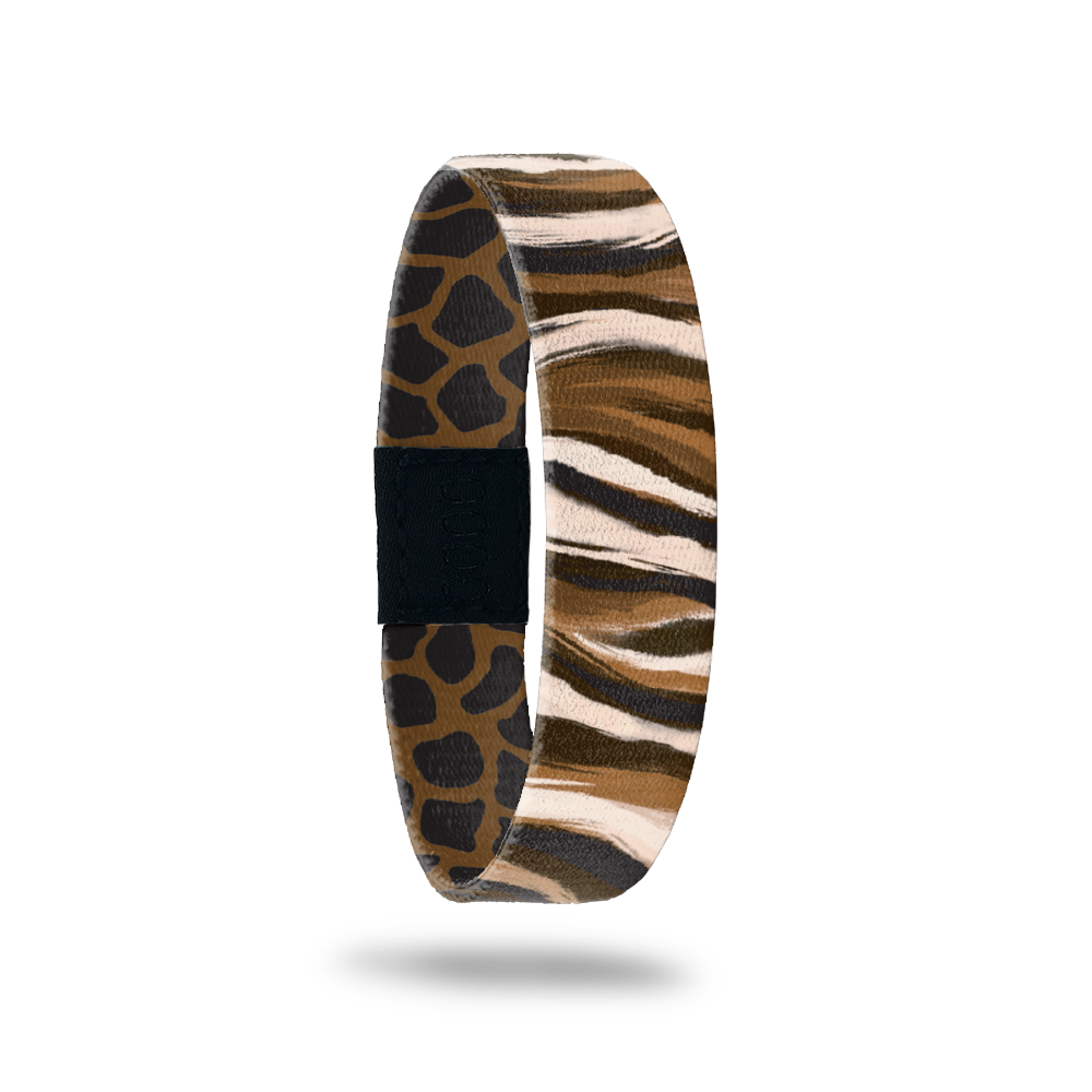 This is a reversible single. The design is brown, white and black zebra print. The inside is brown abd black giraffe print with the words Broken But Not Defeated. 