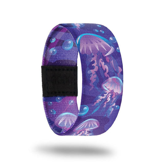Outside design of Electric Bloom. Shades of purple background with blue illustrated bubbles and illustrated jellyfish that are purple with blue highlights