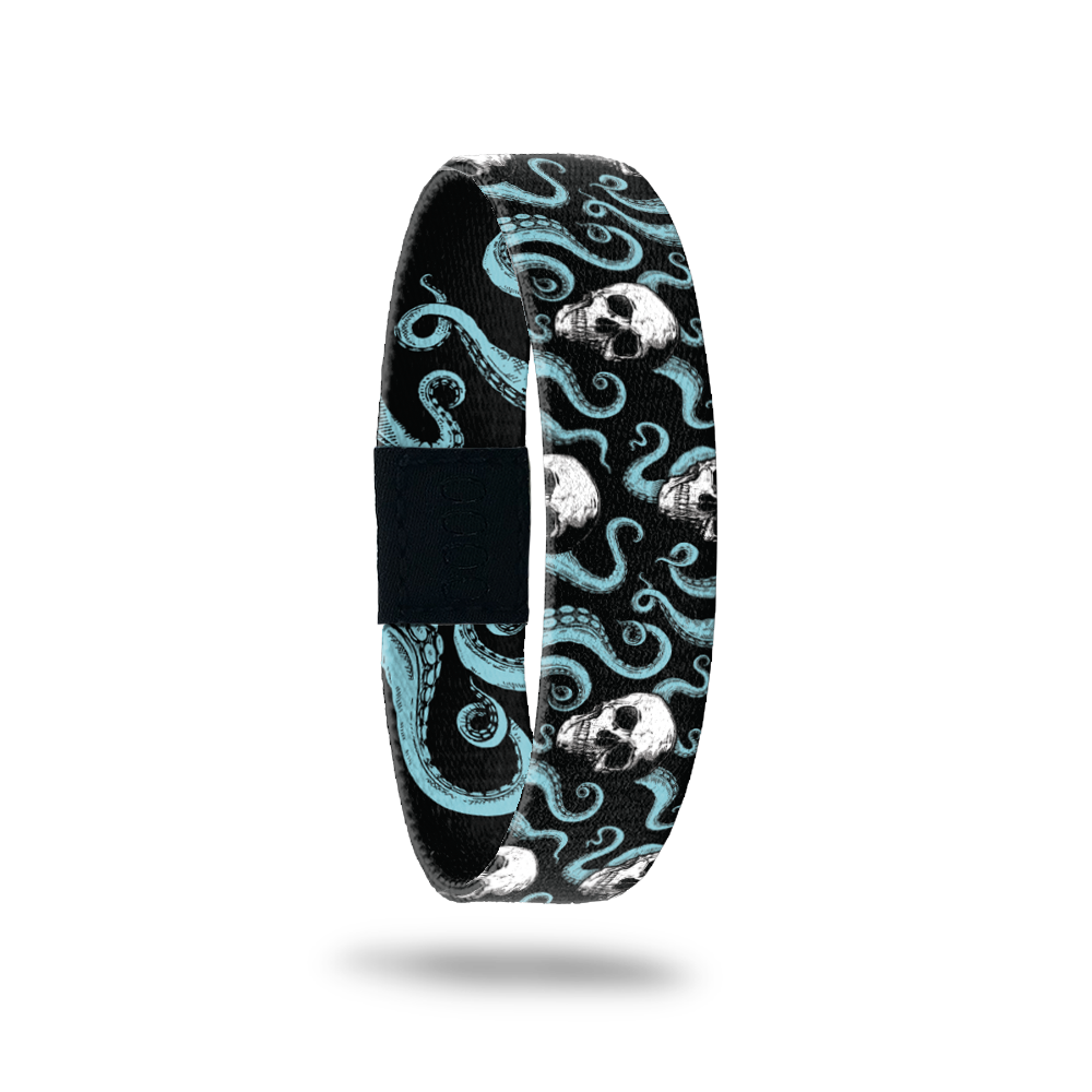 Single wristband with black base and teal octopi all over. White skulls around the tentacles. Inside reads Fight For What You Believe In. 