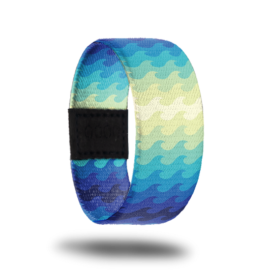 Outside design of Go With The Flow. Simple drawn wave pattern with gradient colors of dark blue to light blue to pale yellow back to light blue to dark blue.
