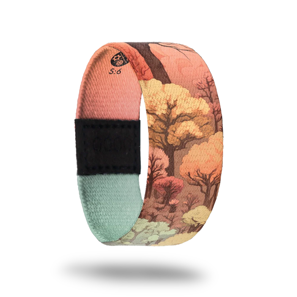 Outside is a forest with trees all over in the muted colors of pink, green, yellow and orange. 