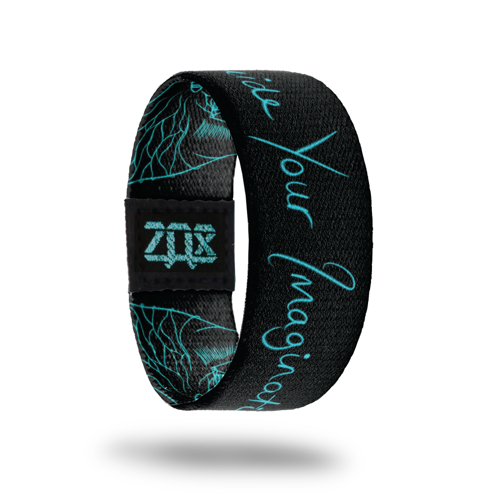 Inside is all black with teal glowing font that says Guide your Imagination