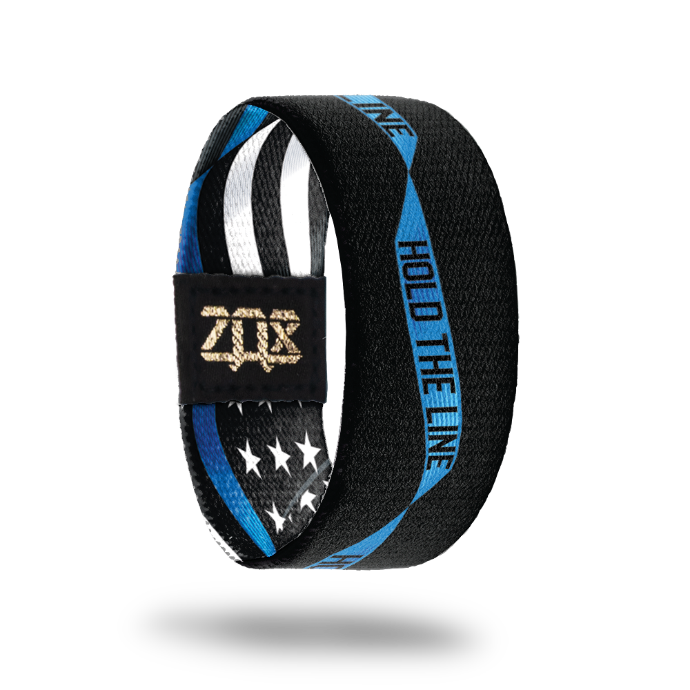 Inside Design of Hold The Line. black background with blue single ribbon running along the center with Hold The Line in the ribbon in black