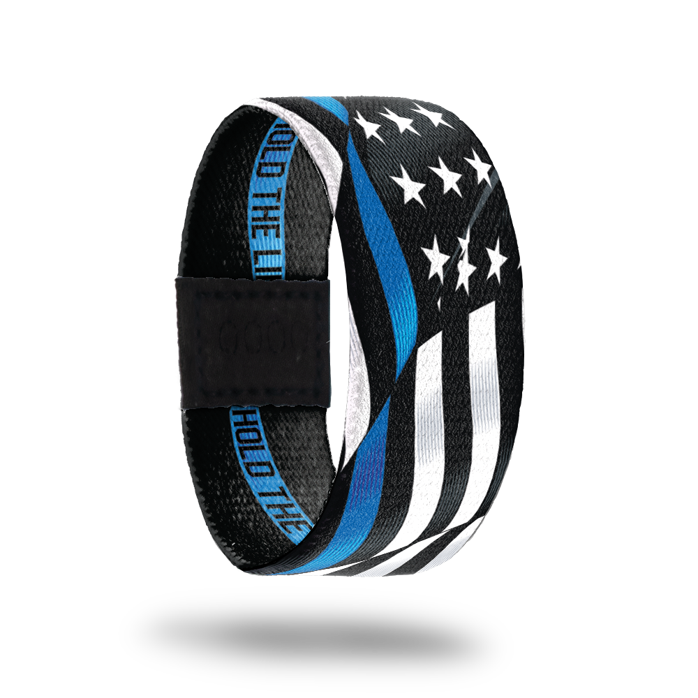 Outside Design of Hold The Line. wavy black and white United States flag with a line of blue for one bottom stripe of the flag