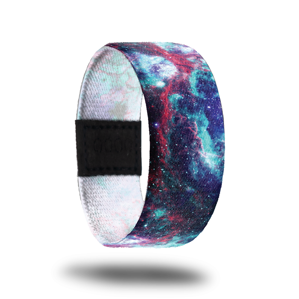 Outside design of I Am____. A space image with blends of dark purple, light blue, and red-pink.
