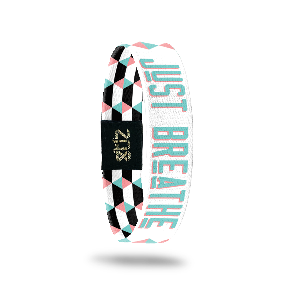 Inside Design of Just Breathe: geometric white and pink design with blue with pink outline text ‘Just Breathe‘