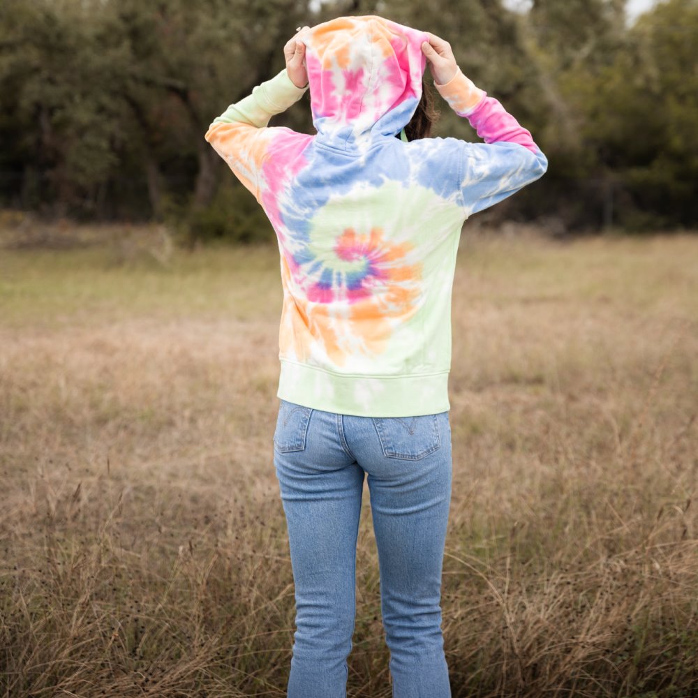 Back of someone wearing the hoodie in the woods