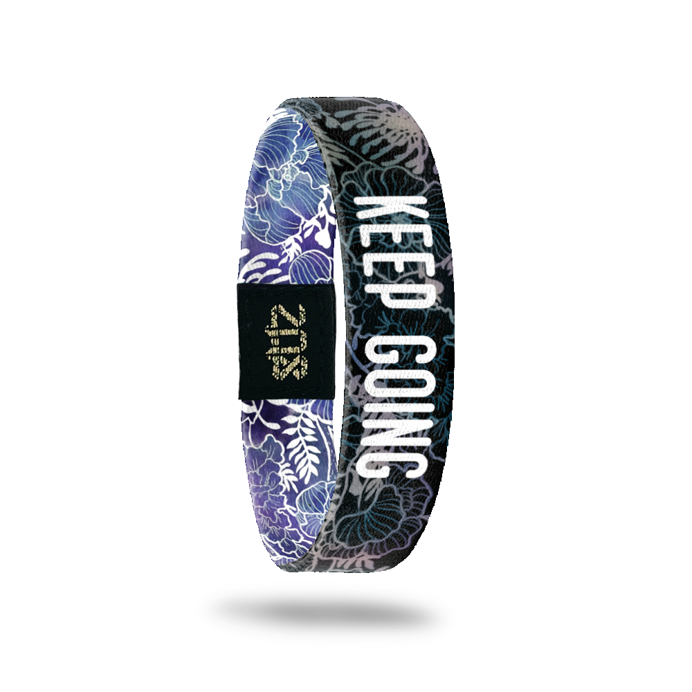 Inside Design of Keep Going: black and grey floral sketch with white text overlaying ‘Keep Going’