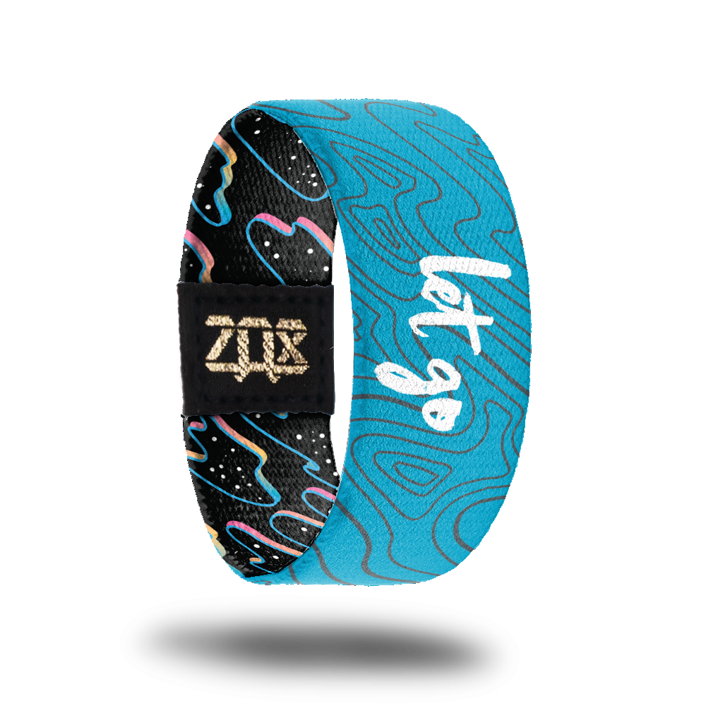 Inside design of Let Go. Light blue background with thin grey wavy lines and Let Go in the center in white text