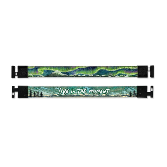 Shows outside and inside design for Live In The Moment imperial with black aglet clasps. Top is the outside design of a small mountain range and an Aurora Borealis with a green and blue tone. Bottom is the inside design with a mountain range scene with a few trees to the side and centered Live In The Moment in white text.