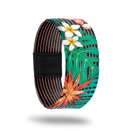 Outside design of Make It Happen. Black background with several thin white lines running along the design. Atop the background are green paint life, white and yellow flowers, and orange flowers