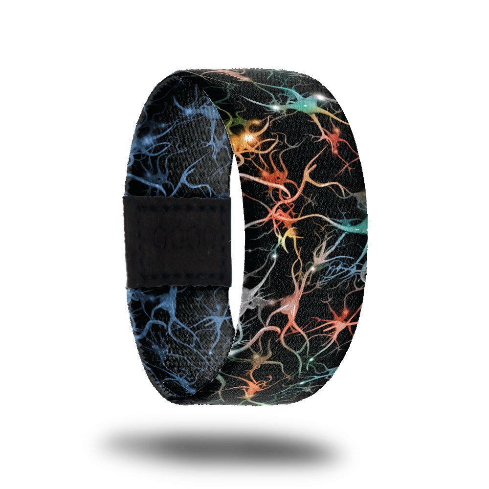 Outside design of Mindset Is Everything. Black background with neon blue, orange, and yellow synapses across the design. The synapses are unique shapes that have thin and thick wavy lines attached to them