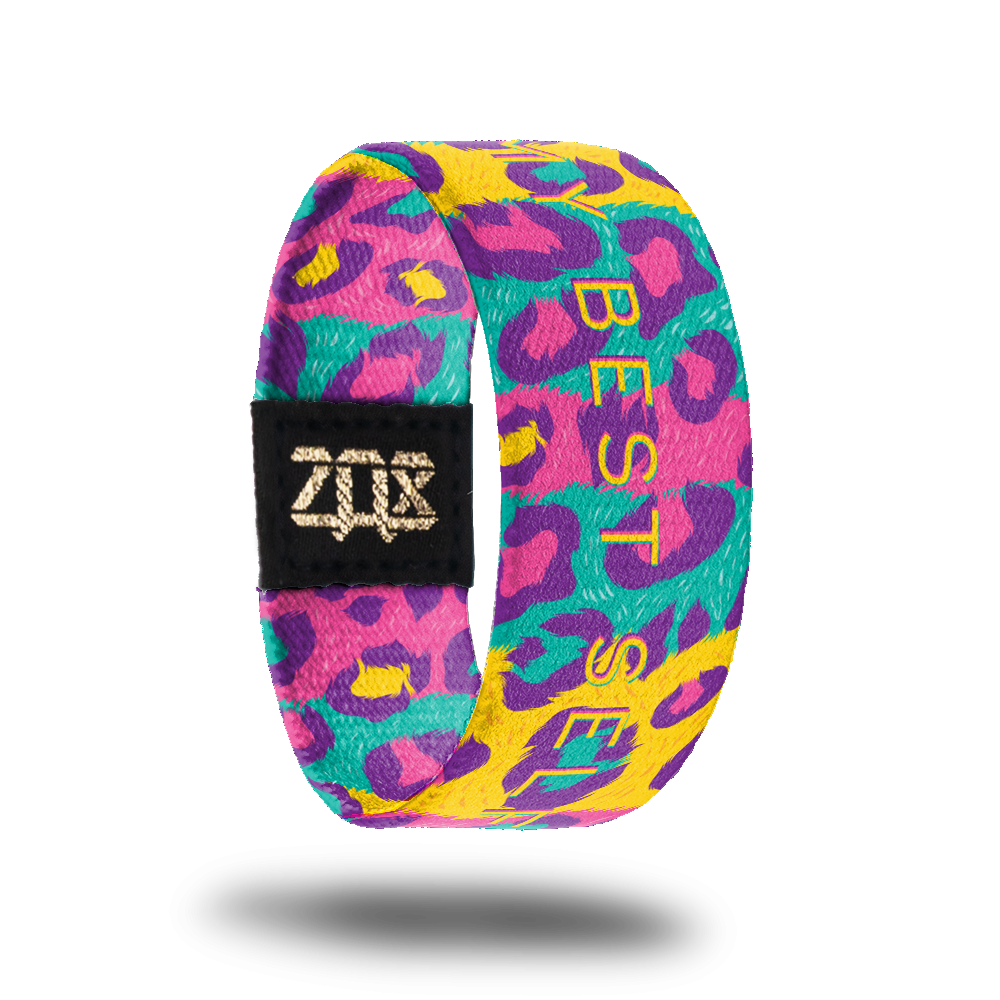 Inside design for My Best Self. Multi-colored spotted cheetah print in teal, yellow, pink, and purple. In the center My Best Self in a thin yellow text