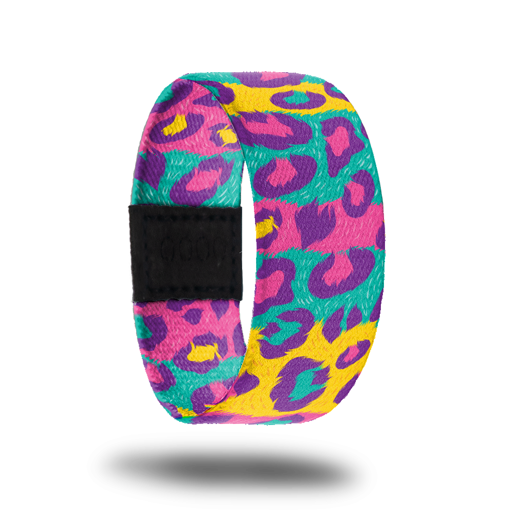 Outside design for My Best Self. Multi-colored spotted cheetah print in teal, yellow, pink, and purple. 