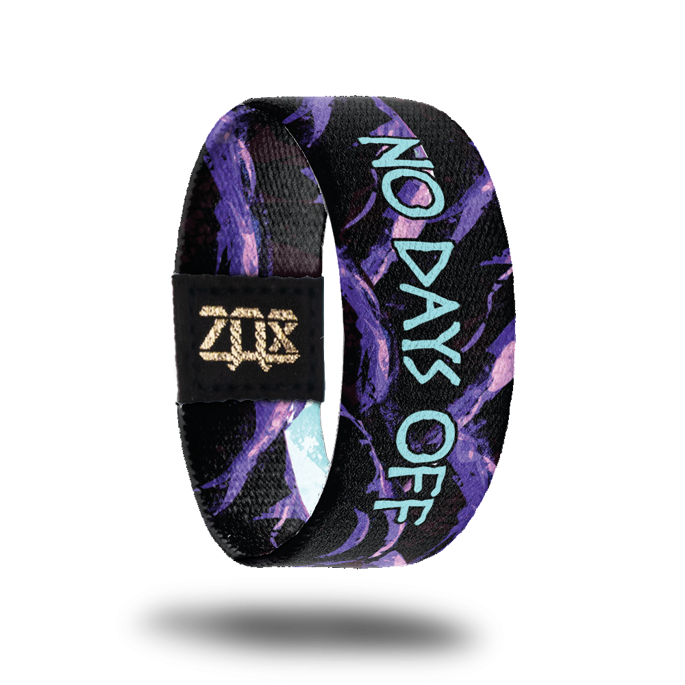 Inside Design of No Days Off: black and purple mountains with a centered blue text ‘No Days Off’