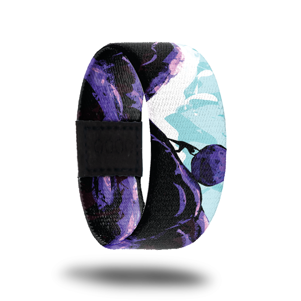 Outside Design of No Days Off: blue and white sketched sky background with black and purple mountains, in the center of the image there is the shadow of a man pushing a boulder up the mountain