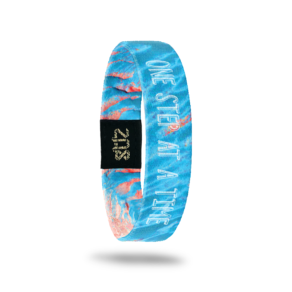 Product photo of the inside of one step at a time. It is an aerial of photoshopped image of Mars that  light blue with white text one step at a time overlaying.