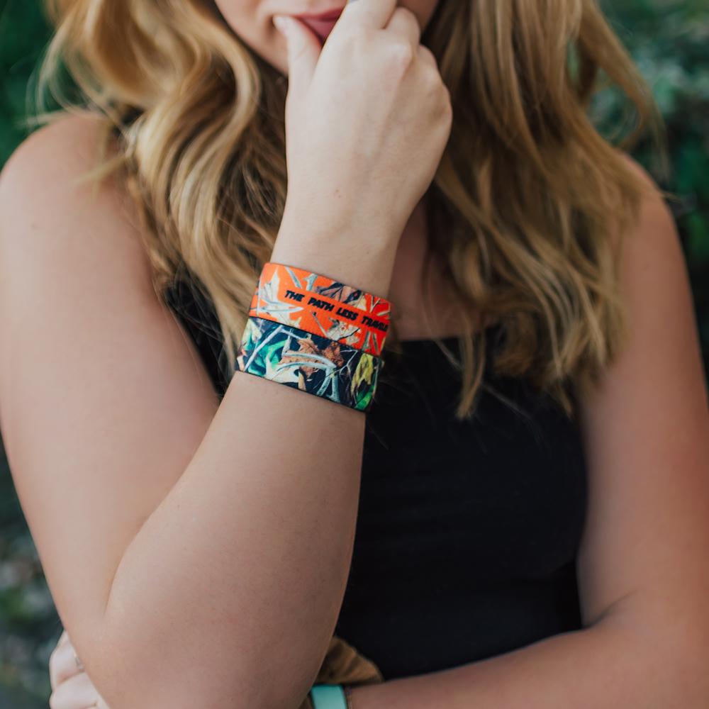 Lifestyle photo of girl wearing two The Path Less Traveled straps showing the inside and outside design