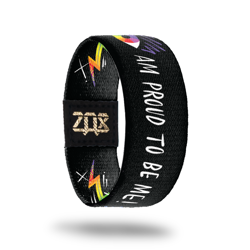 Inside design for Pride. Black background with and illustrated colorful eye image followed by Am Proud To Be Me! in white text 