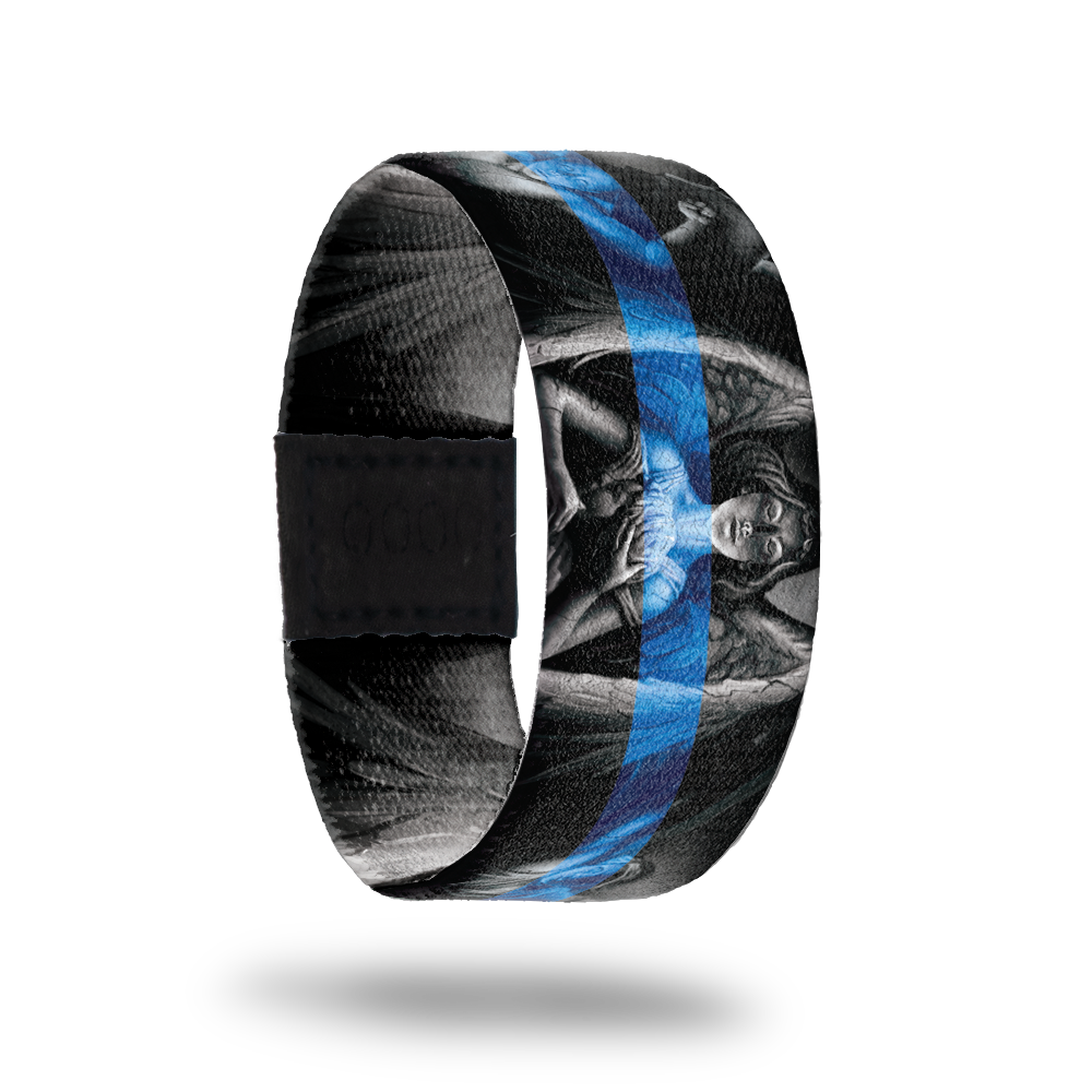 Outside design of Protector, gray scale statue of an angel in the center and two other angels next to the centered angel with a black background. With a blue transparent line centered across the design.