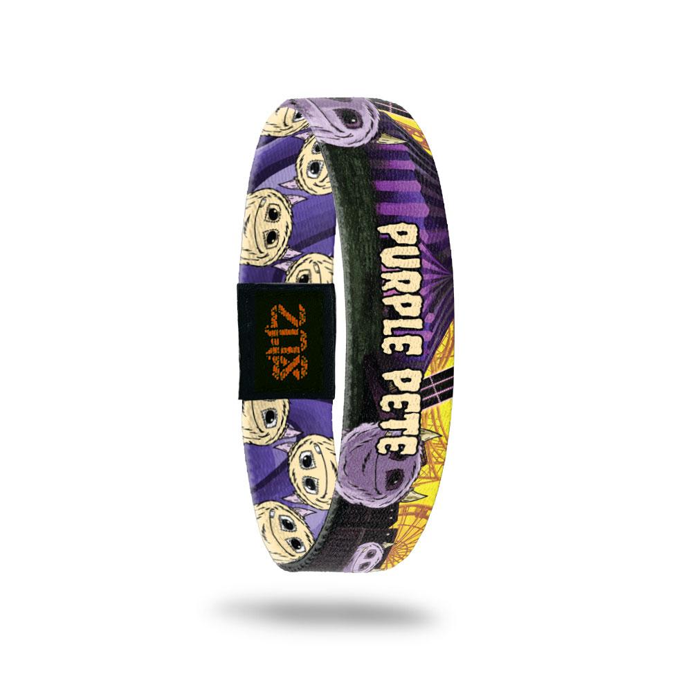 Product photo of the inside of 2020 - Day 2 - Purple Pete: purple and yellow carnival design with purple monster with horns and one tooth and pale yellow ' PRUPLE PETE' text