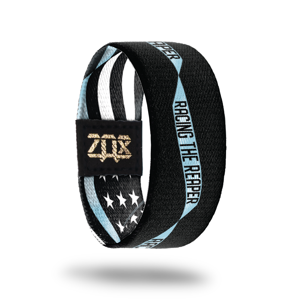Inside Design of Racing The Reaper. A black background with light blue single ribbon running along the center with Racing The Reaper in the ribbon in black