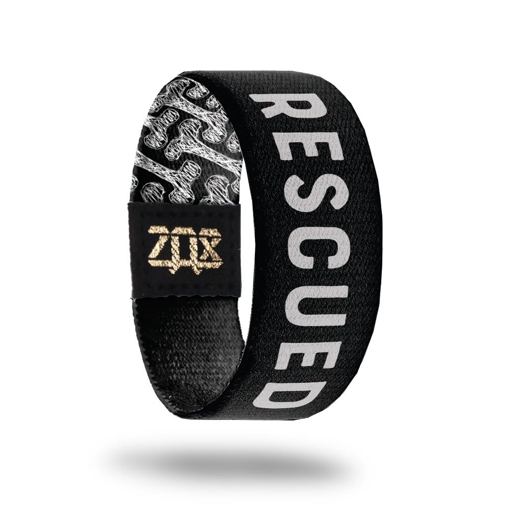 inside design for Rescued. Black background with Rescued in white text at the center 