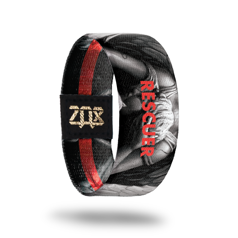 Inside design of Rescuer, grayscale angel in the center of black background with Rescuer in red transparent text over the angel