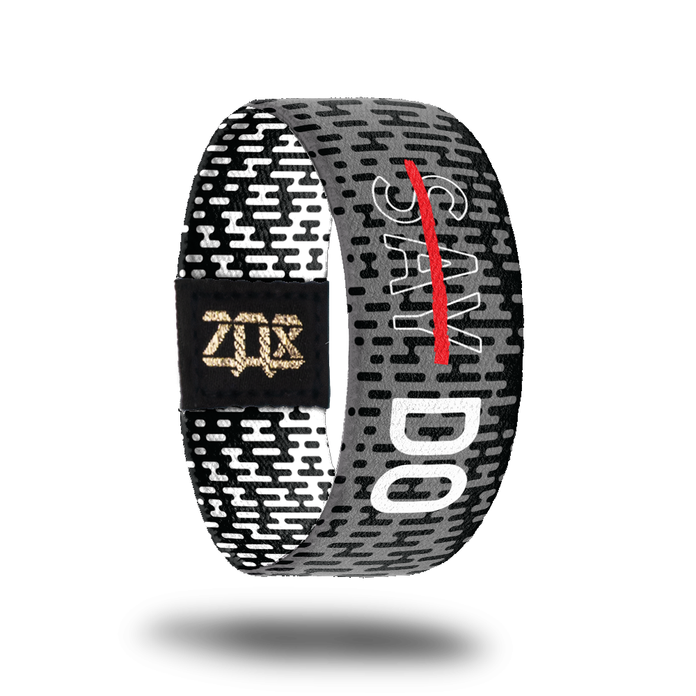 Inside design of Do, black and grey pattern of rounded rectangle shapes. Text in the center has word say in grey with white outline of the letters and a red line across the word Say. Next to Say is the Word DO in bold white