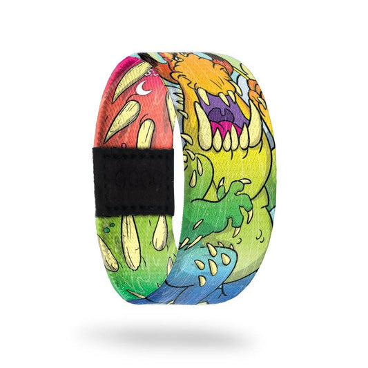 This is a reward, do not purchase. Strap is multicolored monsters all over and reads Sing Anyways inside. 