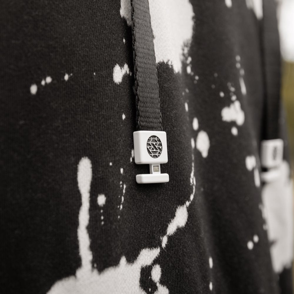 Closeup of the aglets on hoodie strings. 