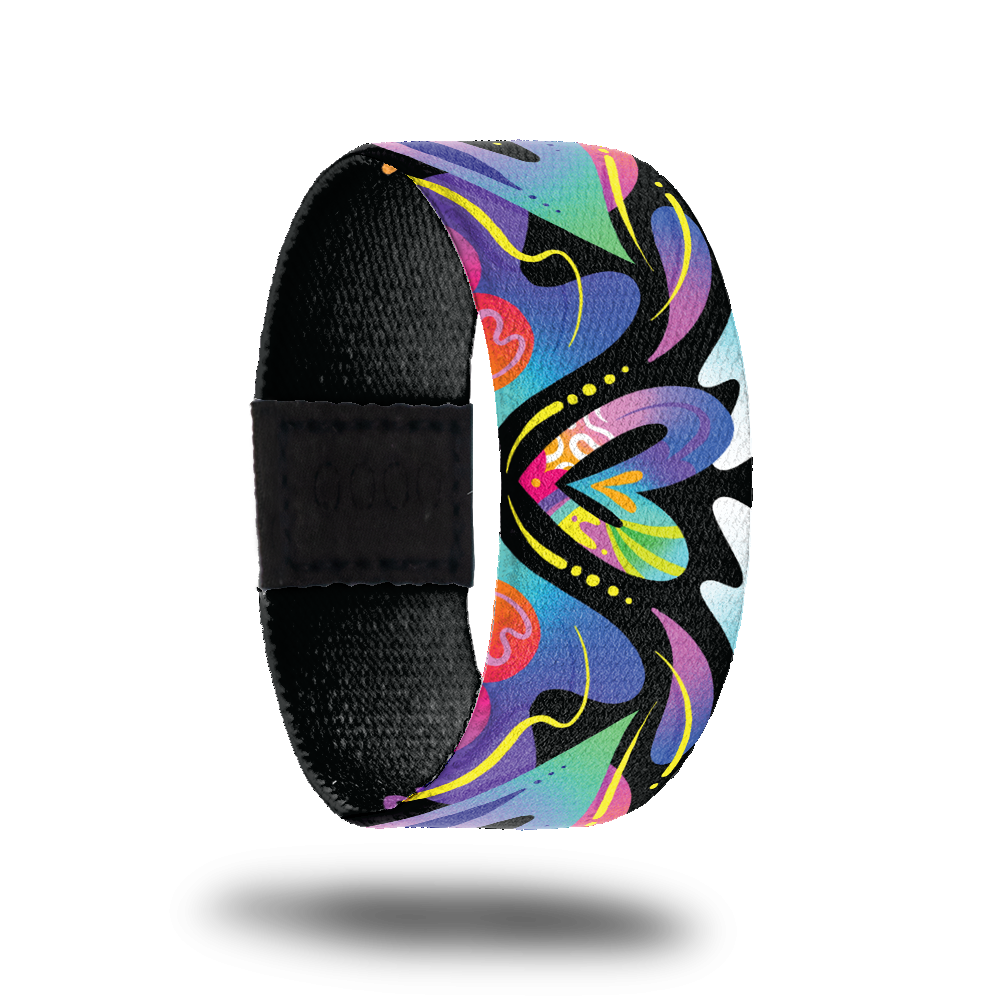 Outside design for Spread Love. Colorful blend of colors with different shapes and a heart shape in the center of the design