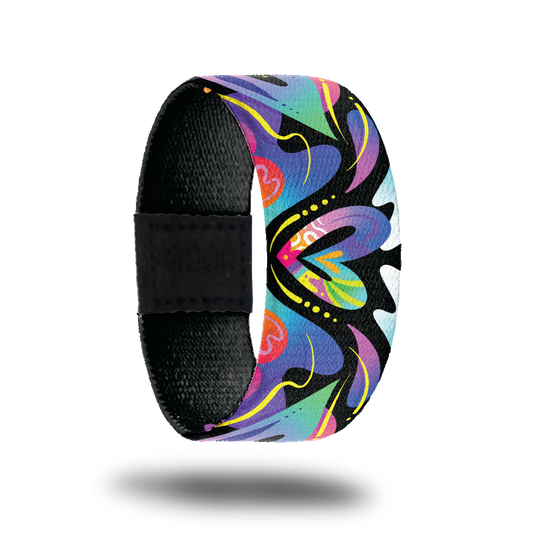 Outside design for Spread Love. Colorful blend of colors with different shapes and a heart shape in the center of the design