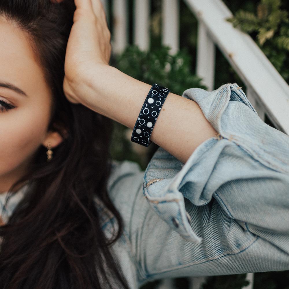 Lifestyle image close up of Take A Chance on model's wrist