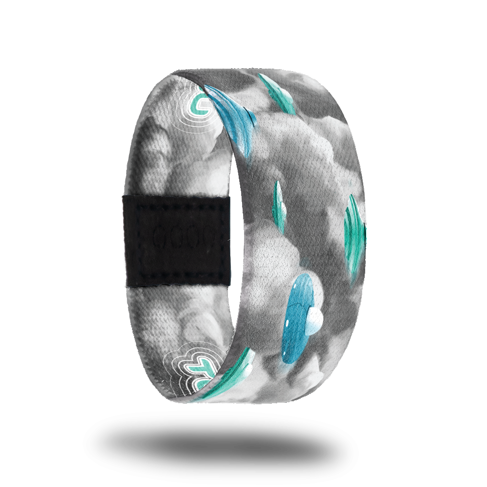 1 of 3 possible outside designs for Take Me With You. Grey clouds with blue ufo space ships