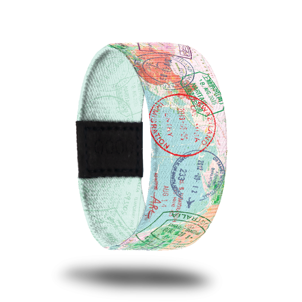 Outside Design of The Places You'll Go: light blue map background with varying passport stamps