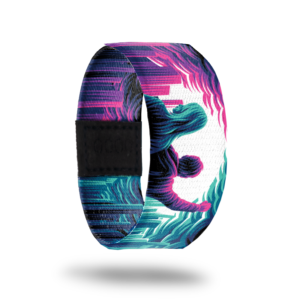 Front Product image of elastic wristband called The Future Belongs To Us. The design is a pink male and blue female with clouds and a city to their sides. Next to the female is a pink design and next to the male is a blue design.