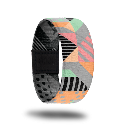 Outside design for Today Is The Day. Mixed geometric pattern with stripes and dots in pastel colors of green, pink, orange, yellow, and grey.