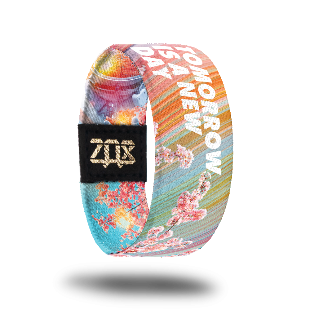 Outside Design of Tomorrow Is A New Day: rainbow background with cherry blossom trees and bold white 'Tomorrow Is A New Day'